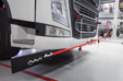 How often should you perform a wheel alignment on heavy vehicles?